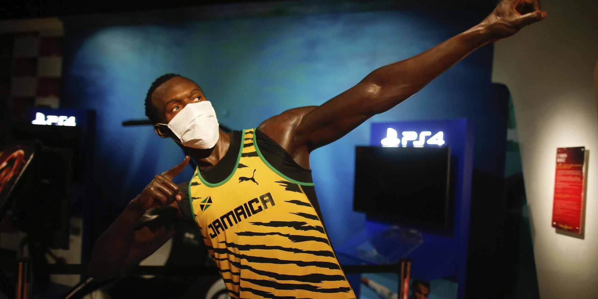 En bild på en vaxfigur av Usain Bolt bärandes munskydd på Madame Tussaud i Istanbul från den 20 juli 2020.